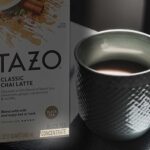 Box of tazo chai Concentrate beside white mug