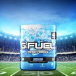 Tub of blue ice g fuel on the 50-yard line in a football stadium
