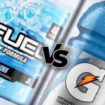 Tub of g fuel blue ice beside bottle of gatorade blue frost with VS between them