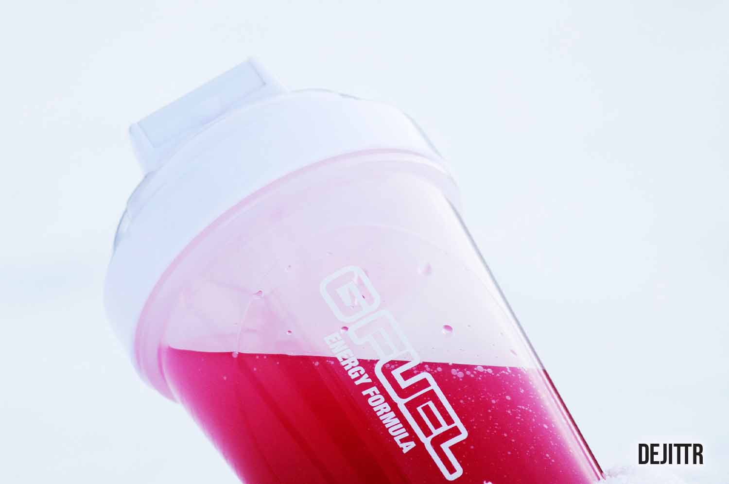 g fuel shaker bottle with red liquid in it