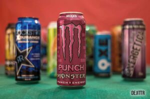 variety of energy drinks in front of a red background